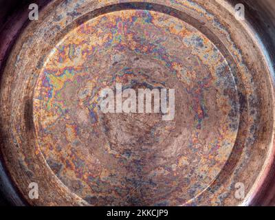 Detail of oil stained bottom of a stainless steel pan Stock Photo