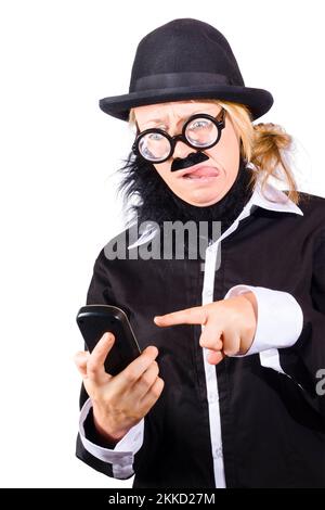 Weird woman in black bowler hat fake beard and mustache wide rimmed glasses sending text message with phone Stock Photo