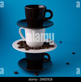 photo multicolored cups in a vertical row Stock Photo