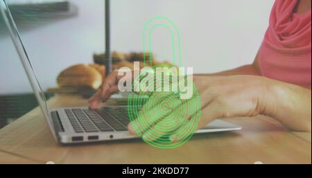 Image of biometric fingerprint padlock, data processing over woman using laptop Stock Photo