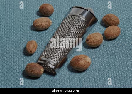 Nutmeg with metal handheld grater! Stock Photo