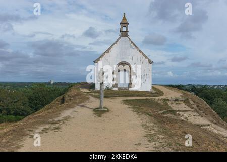 Tumulus Saint Michel church in Carnac on top of an prehistoric megalithic grave mound, Brittany, France Stock Photo