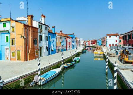 Venice, Italy - April 10, 2007: beautiful colored houses of the old fishermans  city Burano in the laguna of Venice, Italy. Venice is the most visited Stock Photo