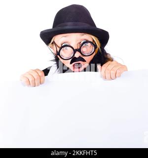 Shocked woman in disguise with black bowler hat, thick rimmed glasses false beard and mustache holding onto a blank banner Stock Photo