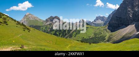 The panorama of Karwendel mountains - look to Teufelskopf and Gumpfenspitze peaks (link) from way to Falkenhutte chalet. Stock Photo