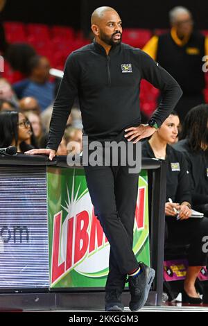 Coppin State head coach Juan Dixon calls out to his team in the first ...