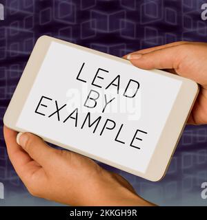 Handwriting text Lead By Example. Business showcase Leadership Management Mentor Organization Stock Photo