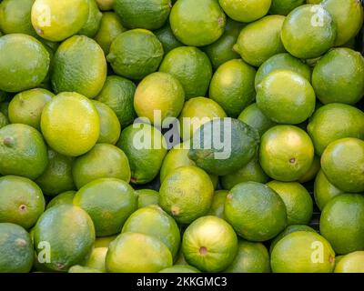 Green limes filling the frame Stock Photo