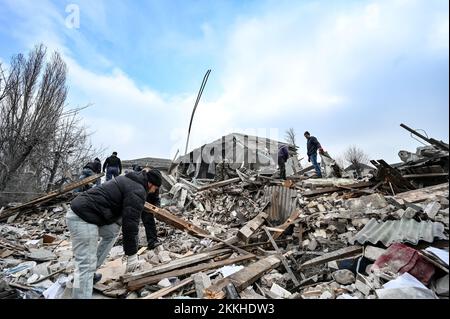 VILNIANSK, UKRAINE - NOVEMBER 23, 2022 - Men remove the rubble at the maternity ward of the Vilniansk Multidisciplinary Hospital destroyed in a missil Stock Photo