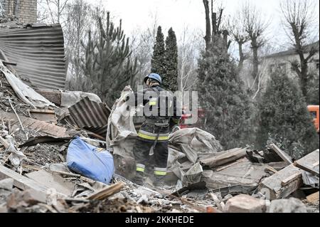 VILNIANSK, UKRAINE - NOVEMBER 23, 2022 - A rescuer removes the rubble at the maternity ward of the Vilniansk Multidisciplinary Hospital destroyed in a Stock Photo