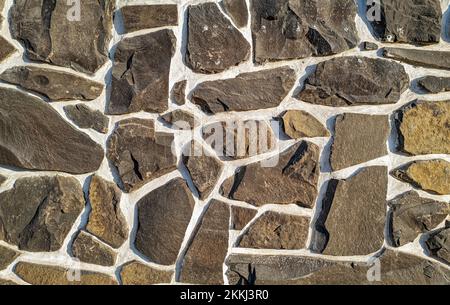 Detail of cemented stone wall design on a building Stock Photo