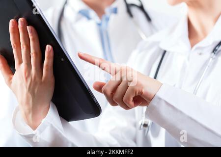 Doctors using digital tablet Stock Photo