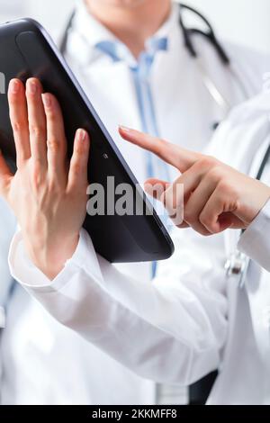 Doctors using digital tablet Stock Photo