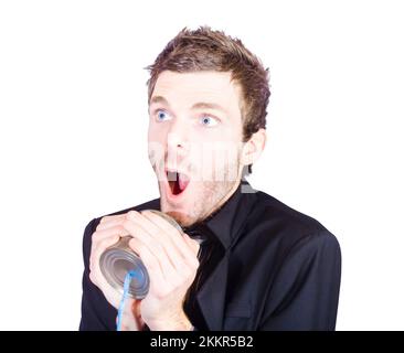 Funny sales man shouting out a sale pitch during a business conversation through a tin can phone Stock Photo