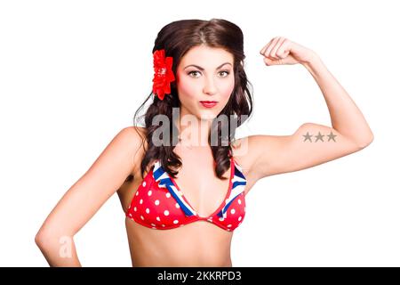 Strong pinup girl flexing biceps muscle. Strength and conditioning concept over white background Stock Photo