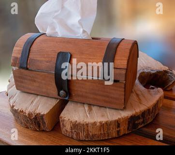 Handmade Wooden Tissue Box on a wood table in Yerevan Armenia Stock Photo