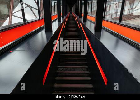Illuminated staircase upwards, gangway to the visitor centre, view upwards, Ruhr Museum, Zeche Zollverein, Essen, Ruhr Area, North Rhine-Westphalia, G Stock Photo