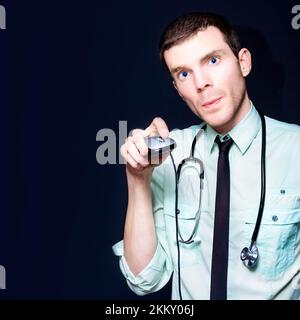 Young Modern Professional Doctor Holding Computer Mouse While Searching The Internet For New Age Health Care Stock Photo