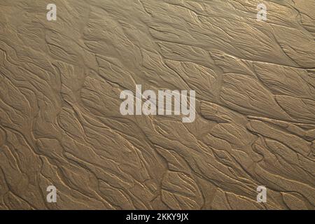 Pattern on wet sandy beach. texture of sand. Stock Photo