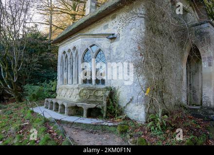 an old estate worker cottage with gothic windows renovated to become a pretty feature of a country estate, Stourhead Wilts UK Stock Photo