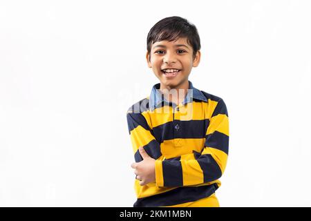 Smiling Indian boy standing in front of camera Stock Photo