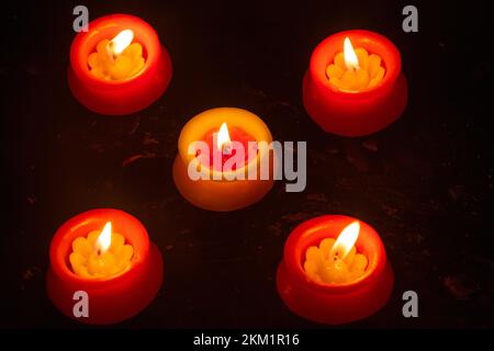 Burning Candles Against Black Background during diwali festival Stock Photo