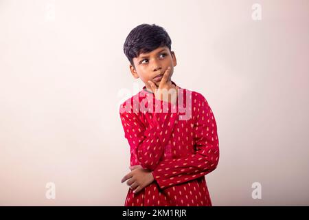 Portrait of a thoughtful boy wearing a traditional dress Stock Photo