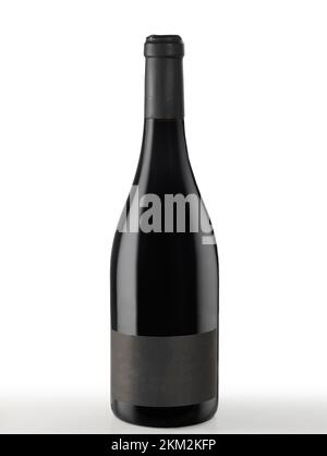 Isolated red wine bottle with blank black label. Stock Photo