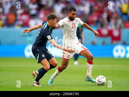 Tunisia's Ali Abdi (right) and Australia's Ajdin Hrustic battle for the ball during the FIFA World Cup Group D match at the Al Janoub Stadium in Al-Wakrah, Qatar. Picture date: Saturday November 26, 2022. Stock Photo