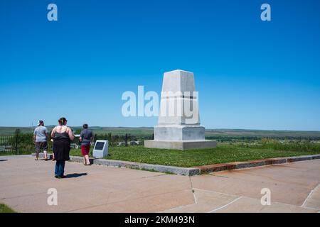 Crow Agency, MT, USA - June 23, 2022: Tourist visit Little Bighorn Battlefield, National Monument, pictured here the monument at the Last Stand Trail Stock Photo