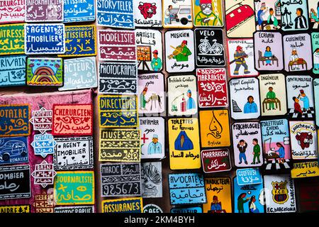 Marrakesh, Morocco - February 28, 2022: All kinds of souvenirs exhibited in a shop in the ancient district of Medina. Stock Photo