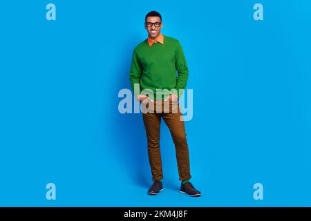 Full body length photo of satisfied professional programmer man put hands pockets rich business owner company isolated on blue color background Stock Photo