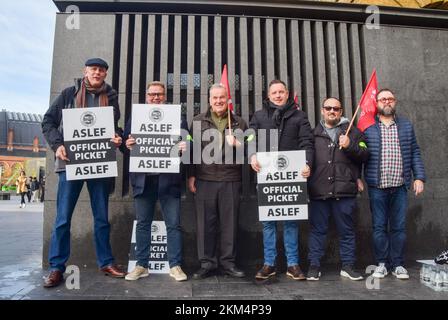 London, UK. 26th Nov, 2022. Members of ASLEF (Associated Society of Locomotive Engineers and Firemen) hold picket line placards at King's Cross Station, as the train drivers' union continues its strikes over pay. Credit: SOPA Images Limited/Alamy Live News Stock Photo