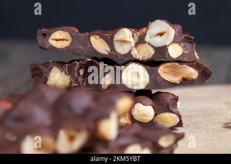 chocolate with cocoa and cocoa butter and roasted hazelnuts and almonds, homemade chocolate with a large number of nuts Stock Photo