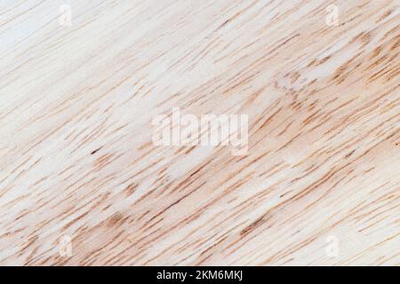 a board made of hevea wood, a light board with a hevea tree structure, from which a board of several boards is made Stock Photo