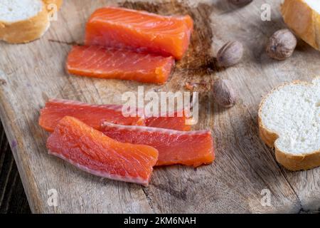 red salted salmon fish meat on a chopping board, salted salmon fish ...