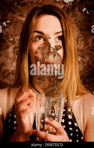Food and beverage artwork on a funny girl slurping down a chocolate milkshake in splashes of fun. Cafe tin sign art Stock Photo