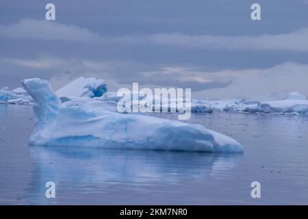 Icebergs floating in the still water around Enterprise Island. Stock Photo