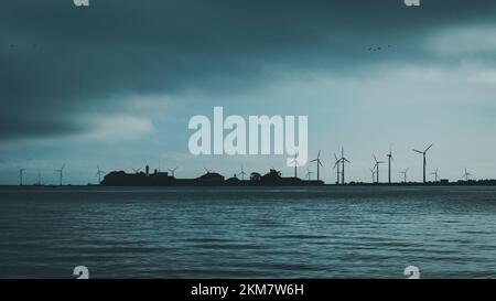 seascape with island and windmills in background Stock Photo