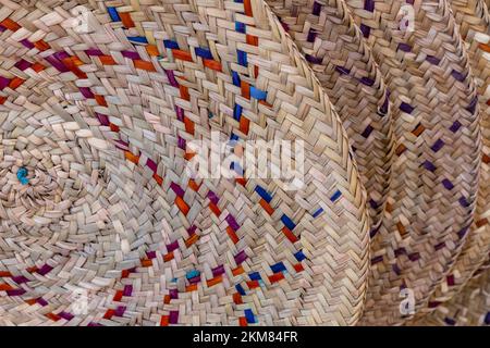 Traditional wicker baskets, exhibited in market shops of the old town Nizwa. Oman. Arabian Peninsula. Stock Photo
