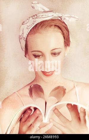 Portrait Of A Beautiful Vintage Vogue Pin Up Girl Reading An Old Fashion Magazine With A Heart Page Fold Stock Photo