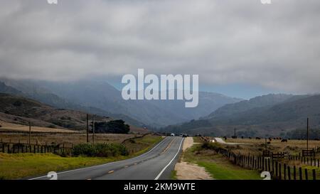 The beautiful highway 1 on a foggy cloudy day along the west coast of California near the Big Sur, USA Stock Photo