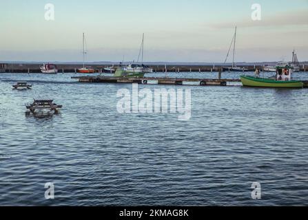 Picnic tables set in the North Sea at a ferry port in evening Denmark Stock Photo