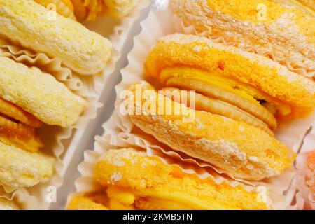 close up of macaroons with orange and chocolate Stock Photo