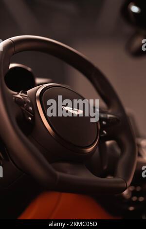 A vertical closeup of an Aston Martin Vantage steering wheel Stock Photo