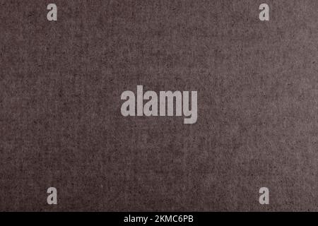 Old weathered brown cardboard. Vintage paper. Scuff texture. Stock Photo