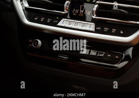 Color car air conditioning buttons close up view inside a car. Car temperature conditioner dashboard panel. Stock Photo