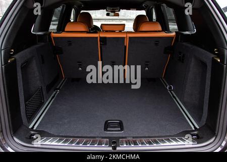 Huge, clean and empty car trunk in interior of compact suv. Rear view of a SUV car with open trunk Stock Photo