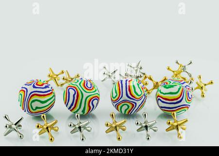 colorful jacks balls on white Stock Photo - Alamy