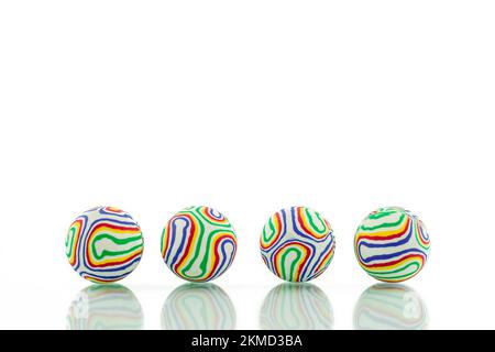 colorful jacks balls on white Stock Photo